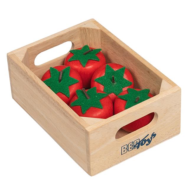 Tomates dans petit harasse en bois