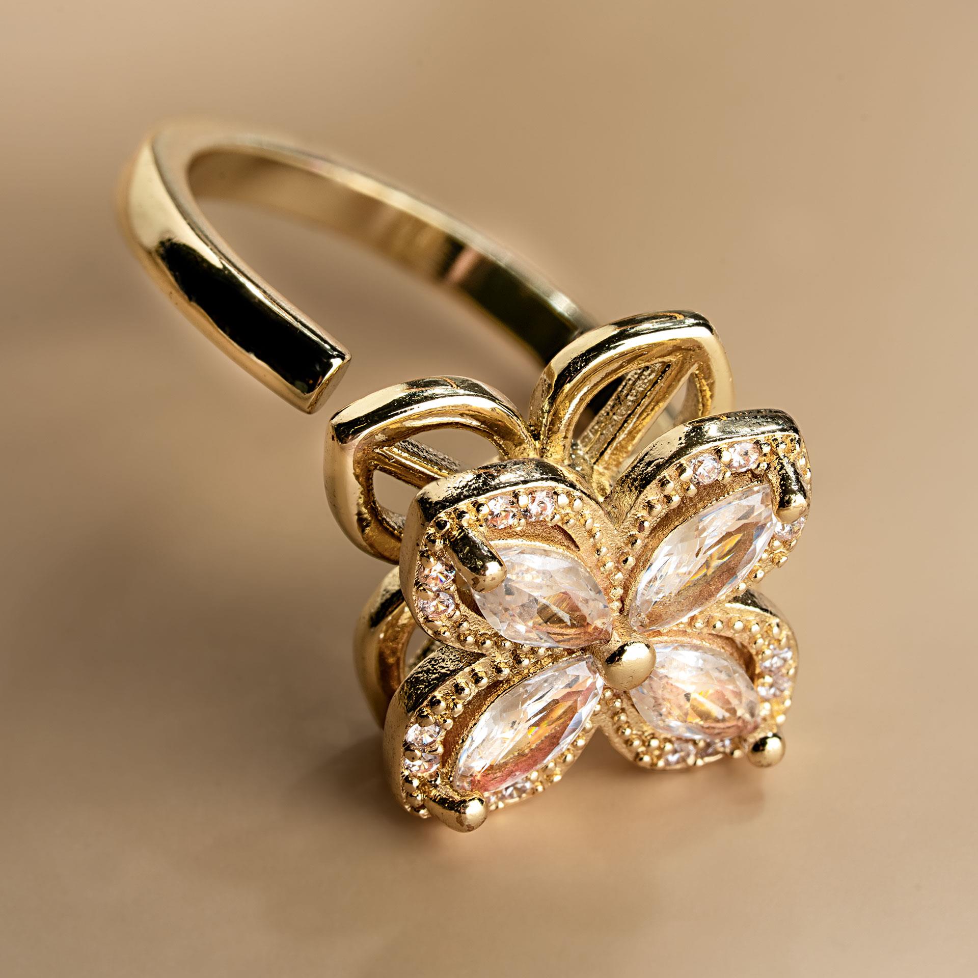Goldfarbener Anti-Stress-Ring mit drehbarer Blütenfront und klaren Steinen
