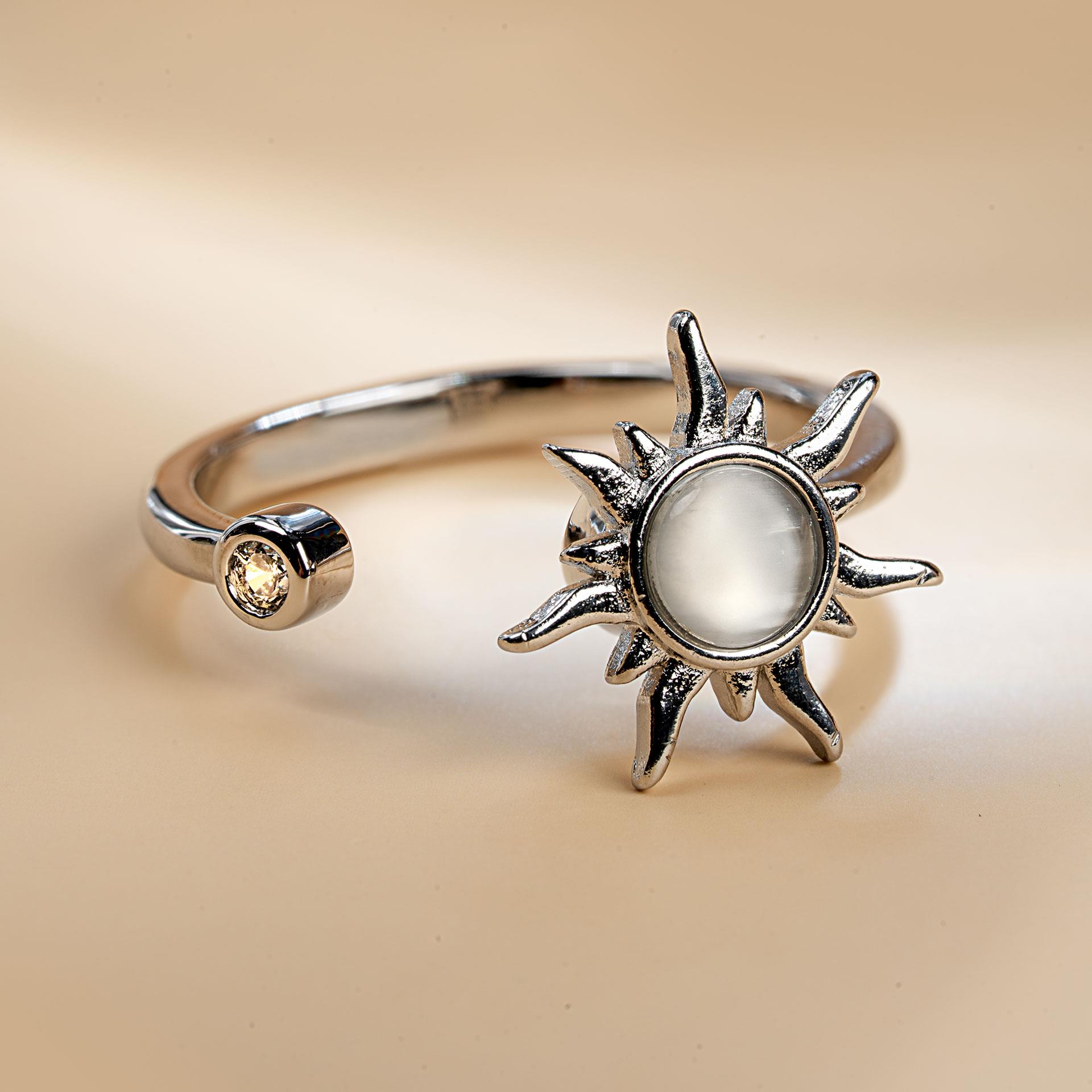 Silberfarbener Anti-Stress-Ring mit drehbarer Sonne