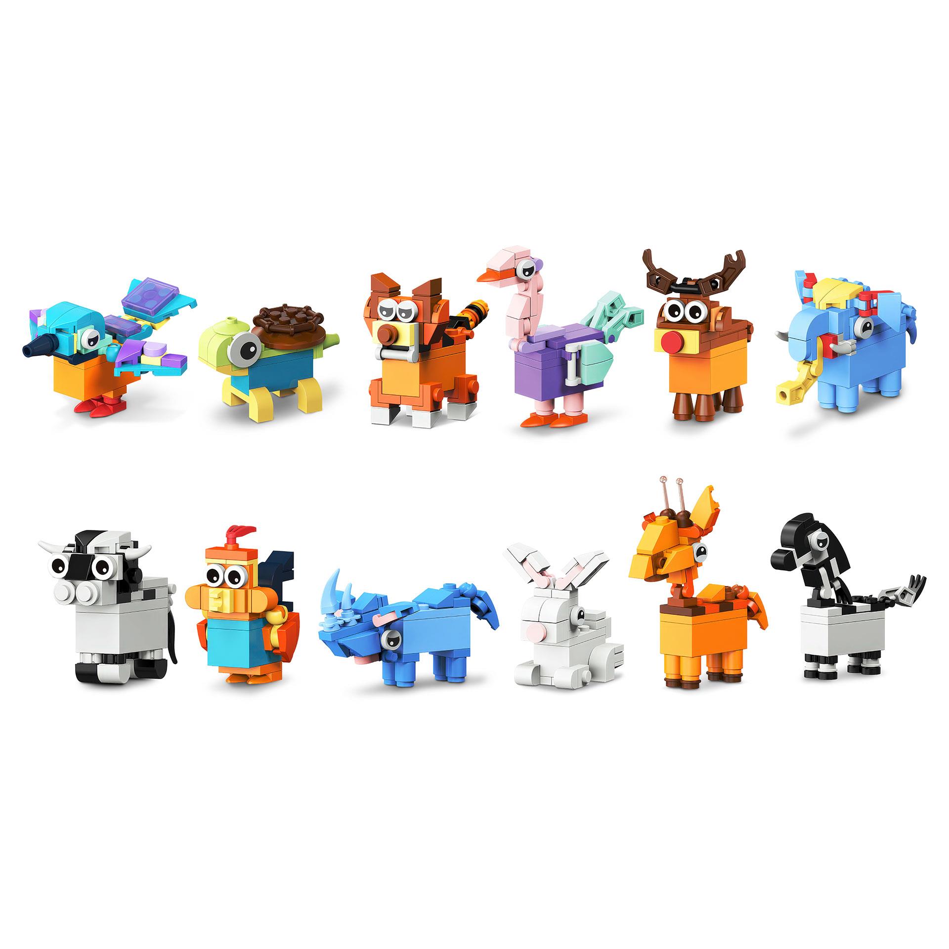 12 set da scrittura con blocchi da costruzione a forma di animali con diversi temperini a forma di animali da assemblare, oltre a matite e gomme da cancellare in una scatola colorata