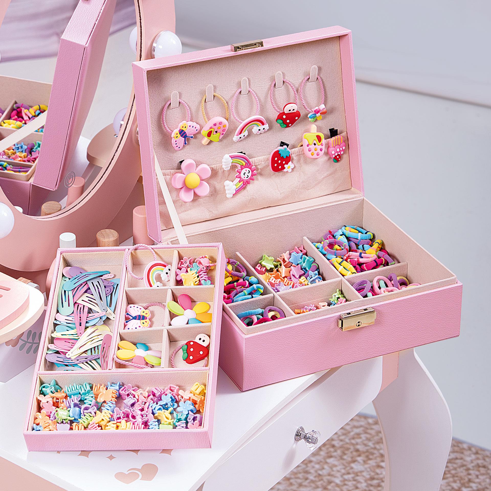 Rosa Kinder Haaraccessoires Box mit Schloss, gefüllt mit vielen bunten Haarspangen, Haargummis und Dekoformen