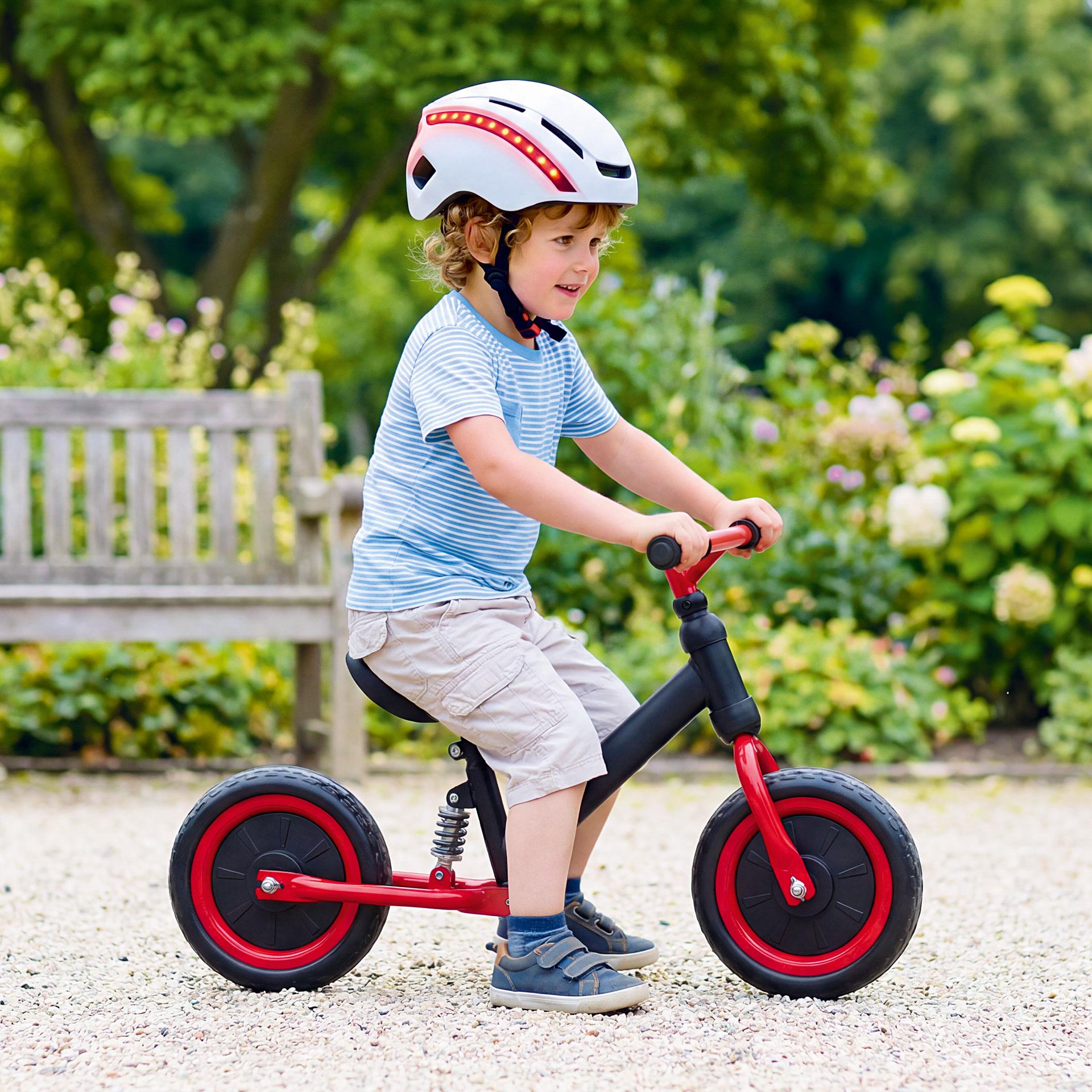 Schwarz-rotes Kinder-Laufrad mit Federaufhängung