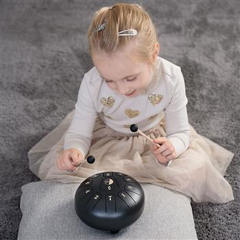 Runde schwarze Zungentrommel mit 11 nummerierten Tonfeldern