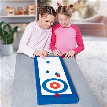 Terrain de curling de table avec pierres de jeu rouges et bleues